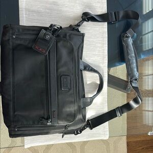 Tumi Black Briefcase with Durable Design and Multiple Compartments